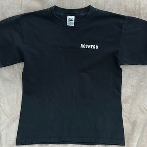 Anvil black tee shirt, size S. Has actress printed on the front and back.